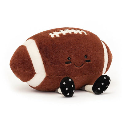 Jellycat Amuseable Sports Football is about 7" x 11". It has two feet that allow this little guy to properly sit. Brown with off white details and black shoes and off white dot 'cleats" and off white legs. 